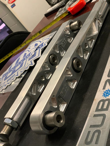 FCS RACE adjustable billet rear lower control arms.